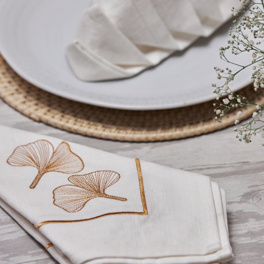 Natural linen Melchiah napkins embroidered with a fine gold ginkgo leaf
